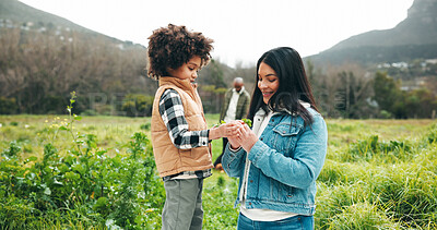 Buy stock photo Outdoor, mom and child with plant, countryside and bonding on holiday, happy and together in nature. Family, adventure and people with boy on vacation, eco friendly and woman with smile for trip