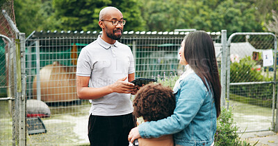 Buy stock photo Woman, child and volunteer in animal shelter for pet care, adoption and dog with discussion of choice. Female person, kid and worker for information, application and tablet in welfare center agency