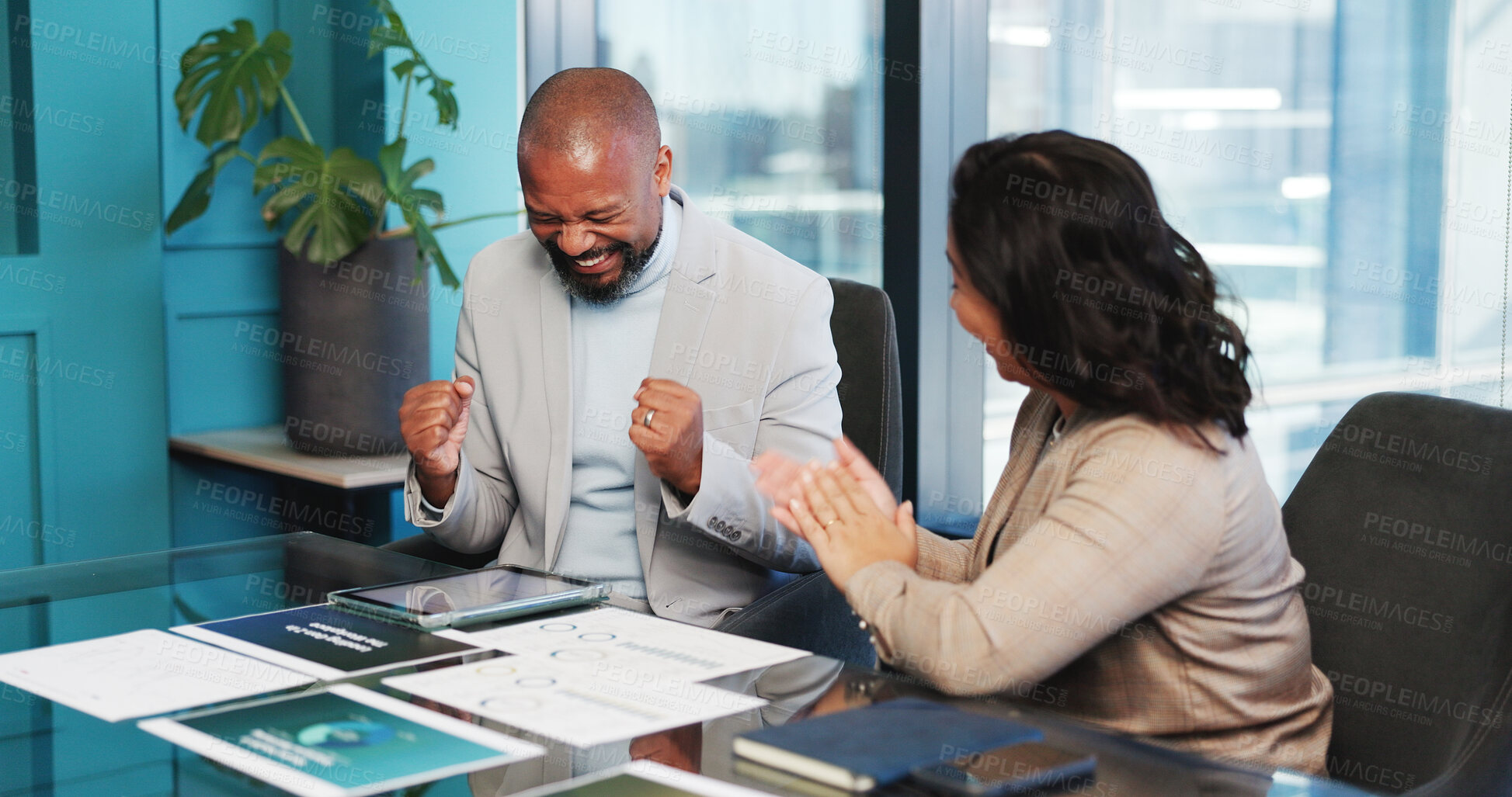Buy stock photo Happy, business people and documents with fist pump for winning, promotion or success in office. Excited, businessman and woman with paperwork or tablet for corporate deal or good news in workplace