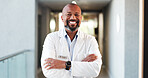 Doctor, healthcare and black man with arms crossed, portrait or cardiology specialist for career ambition. Mature person, employee and professional in hospital for wellness, medical service and pride