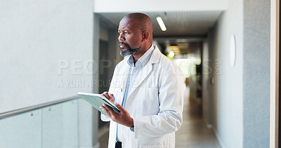 Buy stock photo Thinking, black man and doctor in hospital, tablet and decision with healthcare. Mature person, medical service and professional in clinic, tech or choice with problem solving, app or planning report