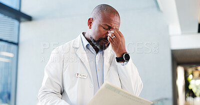 Buy stock photo Doctor, man and stress with folder in hospital for test results, treatment fail or poor prognosis. Healthcare professional, mature black person or headache with medical records for bad news or crisis