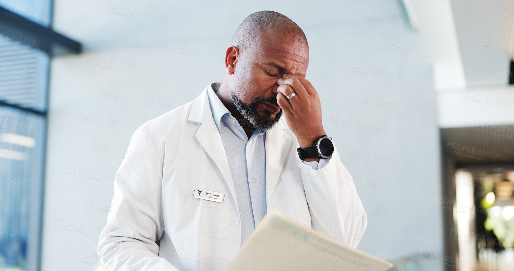 Buy stock photo Doctor, man and stress with folder in hospital for test results, treatment fail or poor prognosis. Healthcare professional, mature black person or headache with medical records for bad news or crisis