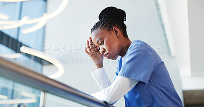 Buy stock photo Medical, low angle or nurse in hospital with thinking, patient loss or stress in surgery result. Healthcare, reflection or black woman in clinic with guilt, disappointment and worry in emergency risk