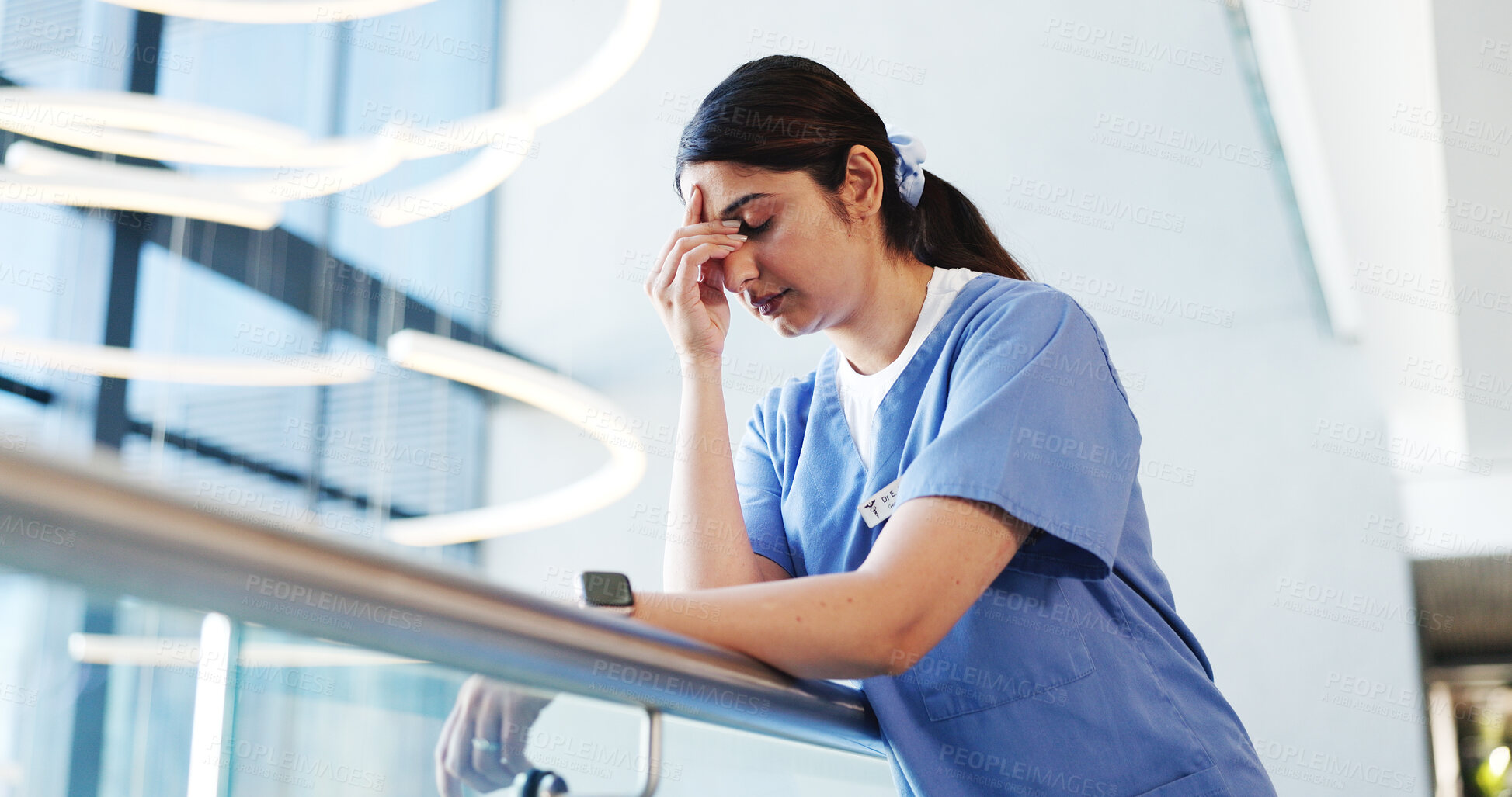 Buy stock photo Nurse, woman and headache of stress in clinic for patient loss, surgery fail and overwhelmed. Low angle, professional and anxiety migraine in hospital hallway for medical mistake or healthcare crisis