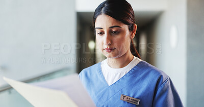 Buy stock photo Doctor, woman and reading in hospital with file for patient history, medical diagnosis and paperwork. Female person, healthcare worker and check folder in clinic for test results, report or document.