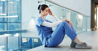 Buy stock photo Nurse, woman and thinking with stress in clinic for operation failure, medical trauma and bad news. Mental health, professional and anxiety on hallway floor for hospital loss or overwhelmed by crisis