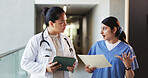 Doctor, tablet and nurse discussion with file in hospital for medical opinion, update or advice. Health team, women and walking in clinic hallway with treatment feedback, surgery schedule or workflow