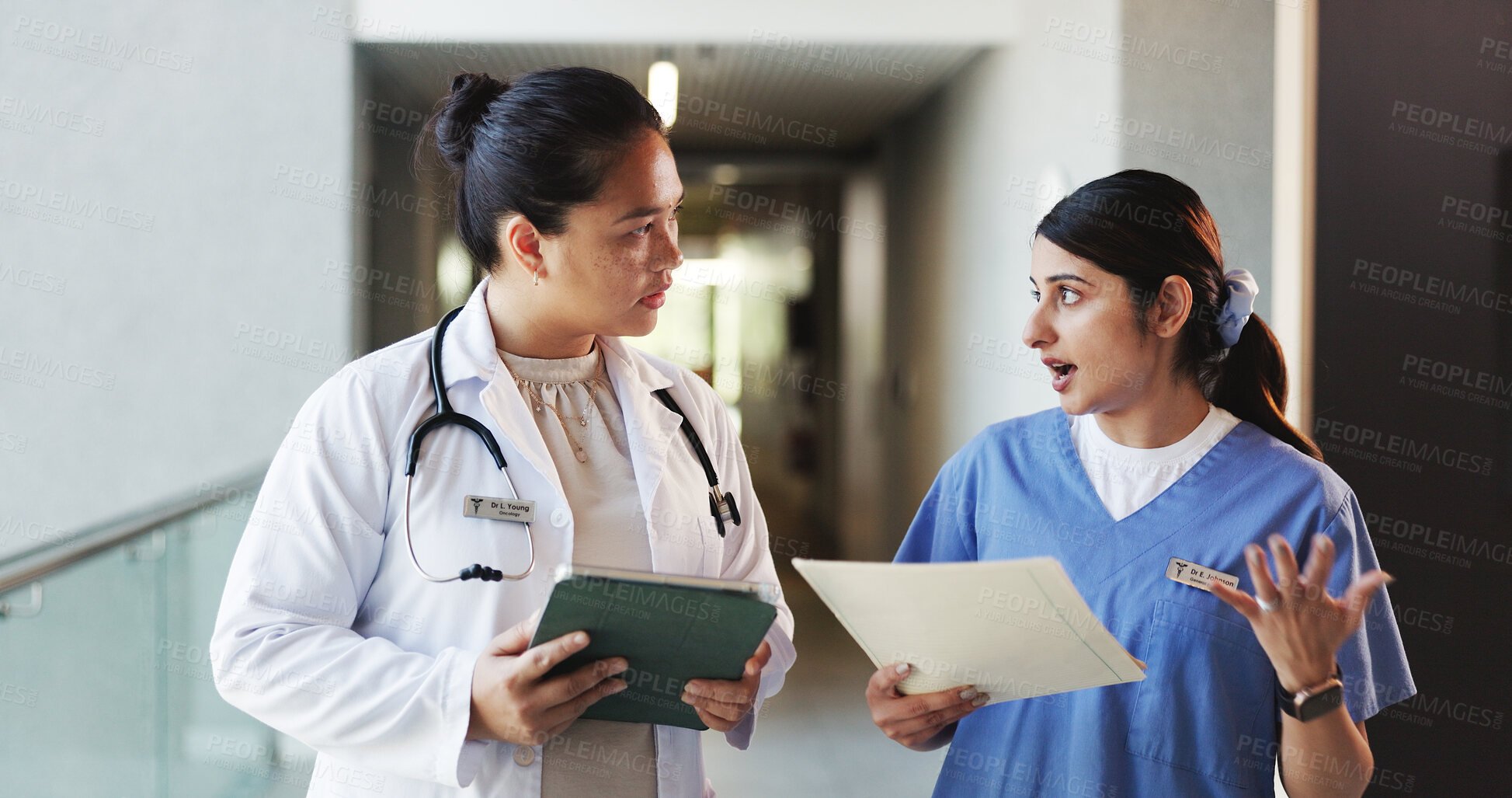 Buy stock photo Doctor, tablet and nurse discussion with file in hospital for medical opinion, update or advice. Health team, women and walking in clinic hallway with treatment feedback, surgery schedule or workflow