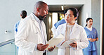 Doctors, discussion and people in hospital, documents and teamwork with feedback. Medical service, man and woman with healthcare, paperwork and support with schedule, treatment plan and cooperation
