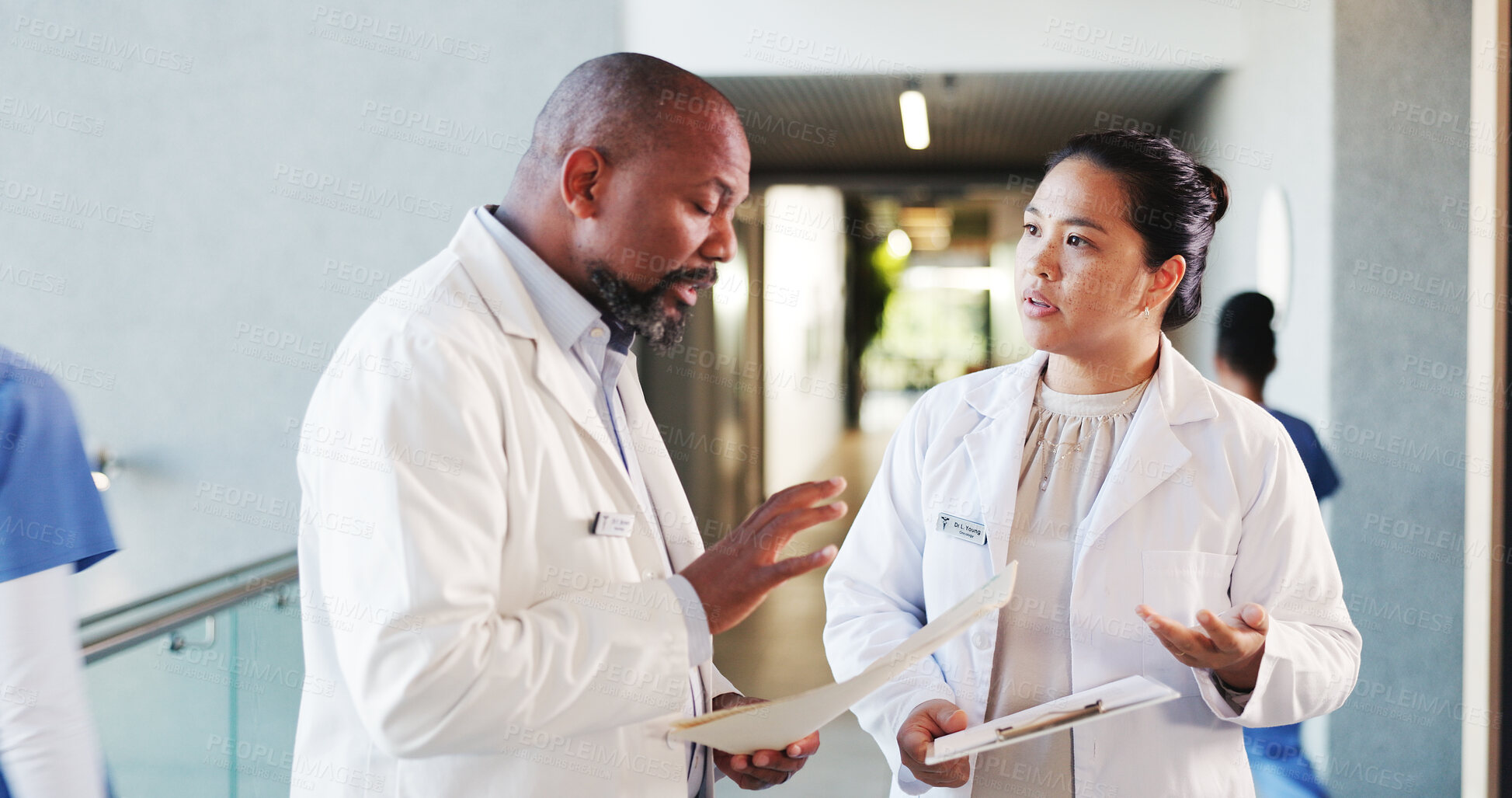 Buy stock photo Doctors, conversation and people in hospital, documents and cooperation with feedback. Medical service, man and woman with healthcare, paperwork and support with clinic schedule, talking and advice