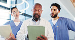 Tablet, meeting and doctor with nurses in hospital with collaboration for medical research. Digital technology, teamwork and group of healthcare employees with surgery planning with records in clinic