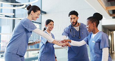 Buy stock photo Happy, people and doctors with handstack in hospital for celebration, surgery success and victory. Smile, healthcare workers and huddle for medical milestone, staff motivation and team achievement