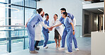 Excited, people and doctors with handstack in hospital for celebration, surgery success and victory. Happy, healthcare workers and huddle for medical milestone, staff motivation and team achievement