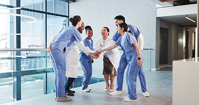 Buy stock photo Excited, nurses and doctors with handstack in hospital for celebration, surgery success and victory. Happy, healthcare people and huddle for medical milestone, staff motivation and team achievement