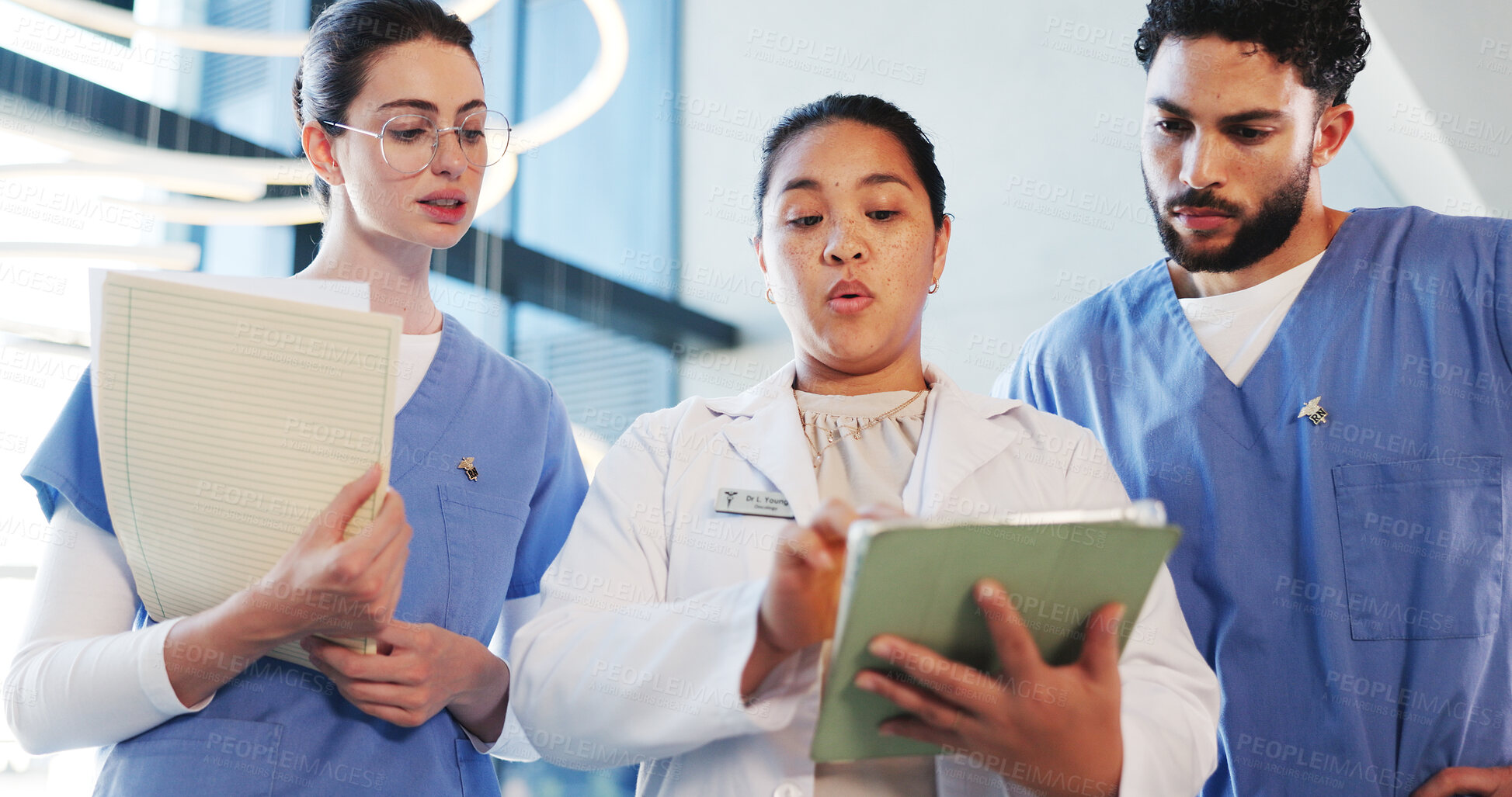 Buy stock photo Tablet, documents and doctors with nurses in hospital with collaboration for medical research. Digital technology, teamwork and healthcare employees with surgery plan with record in clinic from below