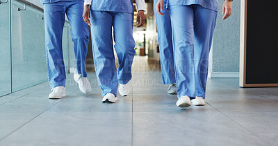 Buy stock photo Legs, people and nurses walking in hospital for staff duty, shift change and medical services. Group, employees and team in lobby for patient care, healthcare treatment and ward round for procedure