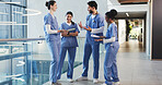 Talking, hospital and med students in lobby for consulting, medical advice and diagnosis. Healthcare, internship and people in conversation, discussion and meeting for results and treatment plan