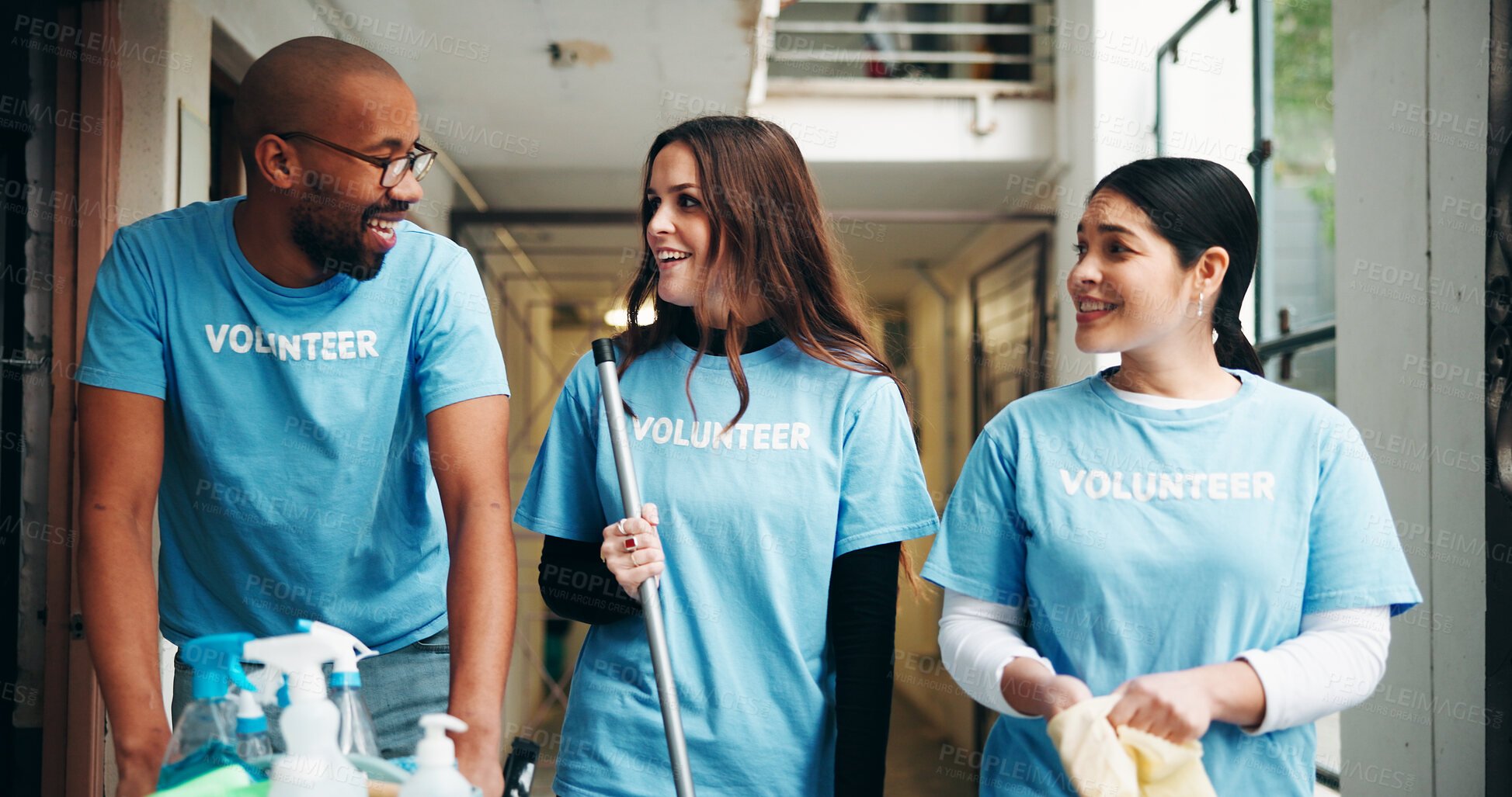Buy stock photo People, volunteer and supplies for cleaning, corridor maintenance and workplace hygiene. Happy, team and walking for hallway cleanliness, ngo briefing and sanitation project for social responsibility