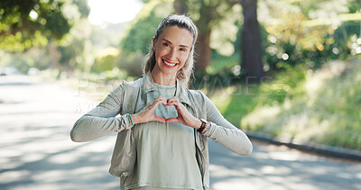 Buy stock photo Happy woman, fitness and portrait with heart hands for love, health or wellness on road in nature. Active, female person or smile with emoji, sign or shape for workout, exercise or physical activity
