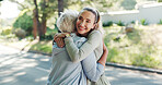 Senior, happy women and hug with personal trainer for fitness, love or workout together in nature. Elderly, female people or coach with smile or embrace for exercise, health or wellness in road