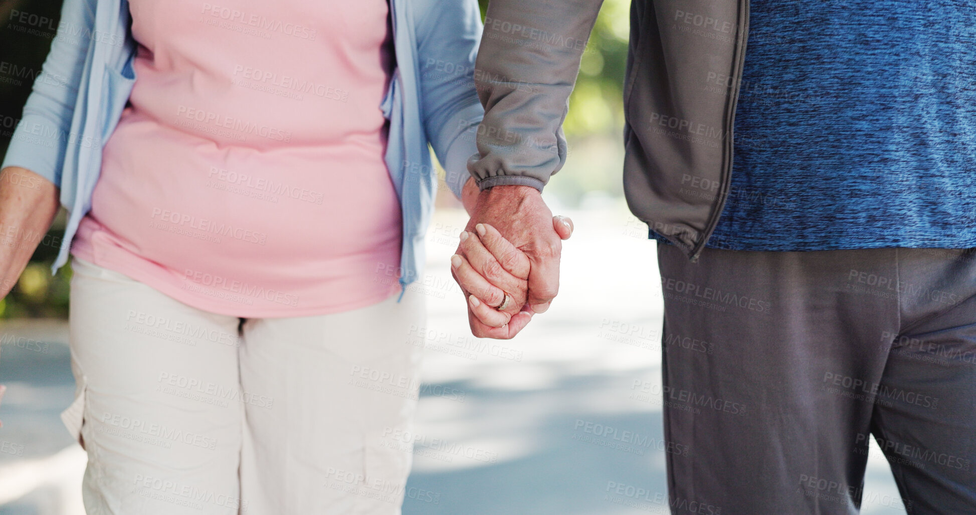 Buy stock photo Senior couple, walking and holding hands with commitment for trust, support or outdoor date in road. Elderly, man and woman with love for holiday, weekend or retirement journey in neighborhood