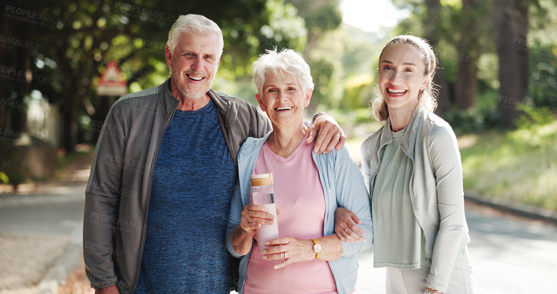 Buy stock photo Park, woman and portrait of senior parents with water bottle for wellness, health and fitness. Outdoor, family and mom, dad and person with smile for active workout, exercise and walking for mobility