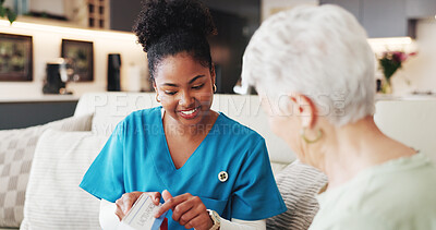 Buy stock photo Caregiver, smile and medicine with senior woman for prescription, instructions and dosage. Happy, nurse and elderly person with pills box for medical treatment, healthcare guidance and health in home