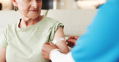 Buy stock photo Caregiver, old woman and arm in nursing home with bandage for flu vaccine, healthcare and wellness. Nurse, elderly person and help with immunity shot plaster, medical safety or protection from virus.