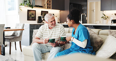Buy stock photo Coffee, healthcare or visit with nurse and old man on sofa in living room of home together. Caffeine, conversation or wellness with medical caregiver and senior patient drinking beverage in apartment