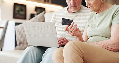 Buy stock photo Senior couple, laptop and hands with credit card on couch for ecommerce, digital purchase or banking. Online shopping, transaction and old people with tech for bills payment, checkout process or home