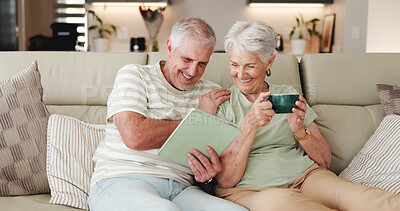 Buy stock photo Coffee, laughing and tablet with old couple on sofa in living room of home together for break. Bonding, funny and streaming app with happy senior people drinking beverage in apartment for wellness