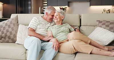 Buy stock photo Love, laugh and relax with old couple on sofa for bonding retirement and connection. Support, happiness and marriage partner with elderly man and woman in living room of home for commitment and joke