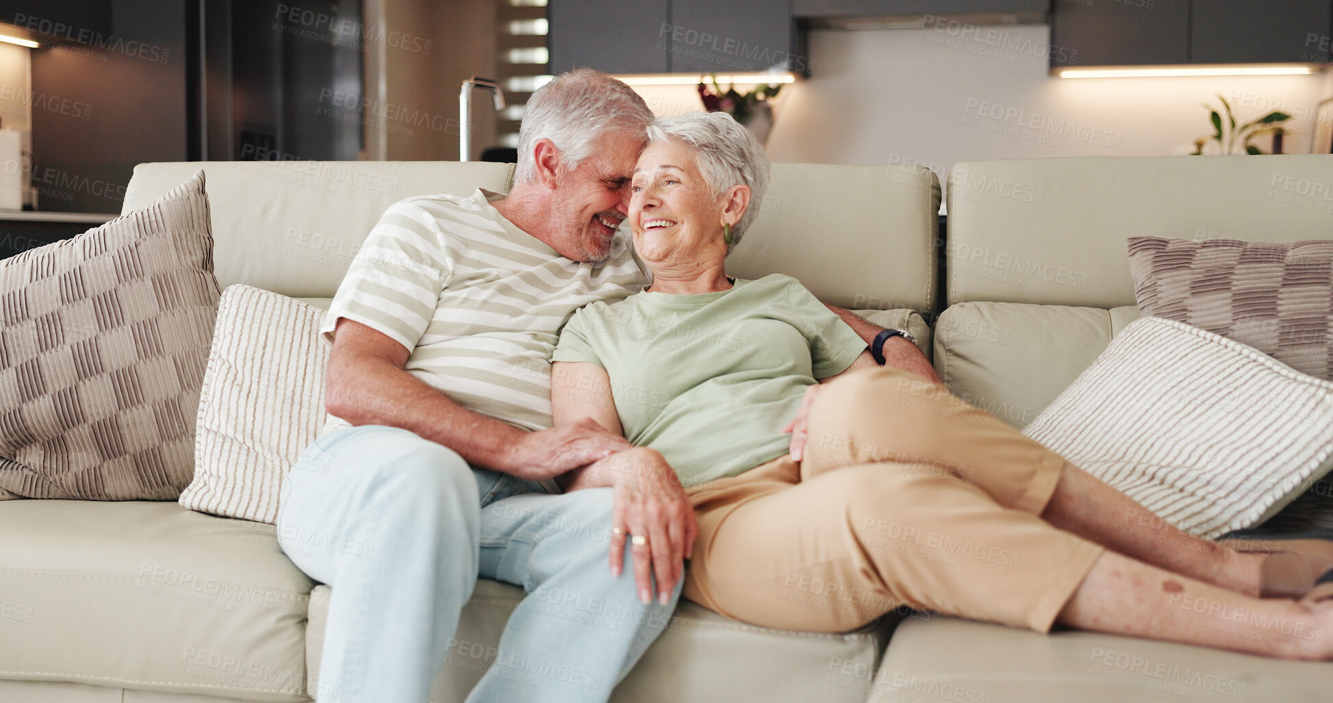 Buy stock photo Love, laugh and relax with old couple on sofa for bonding retirement and connection. Support, happiness and marriage partner with elderly man and woman in living room of home for commitment and joke