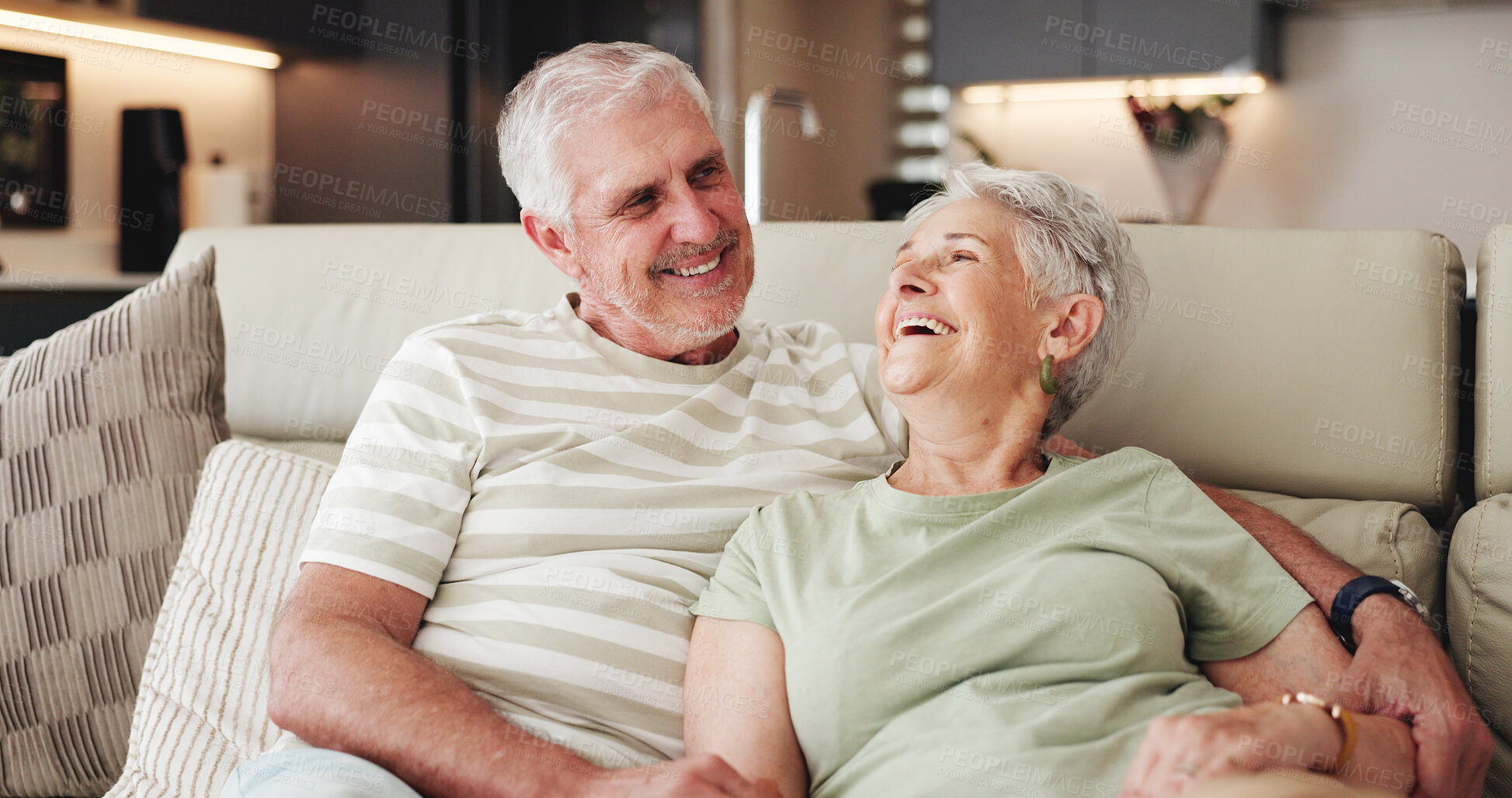 Buy stock photo Love, smile and laugh with old couple on sofa for bonding retirement and connection. Support, happiness and marriage partner with elderly man and woman in living room of home for commitment and joke