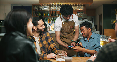 Buy stock photo Waiter, man and phone with payment at pub for beer purchase, paperless transaction or drinking. Friends, people or server with POS machine in bar for easy banking, drinks checkout or social gathering