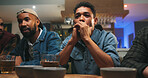 Stress, pub and men watching game with online championship for entertainment together. Broadcast, sports and group of friends with live streaming football match with anxiety for tournament in bar.