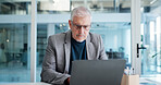Businessman, reading or typing in office with laptop for financial statements, risk management or advice. Mature person, review and research with computer for finance compliance, report and proposal.