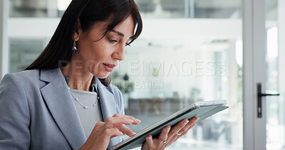 Buy stock photo Reading, mature or business woman with tablet in office, planning or check report for fund management. Review portfolio performance, scroll or wealth manager monitor assets, track market or tech
