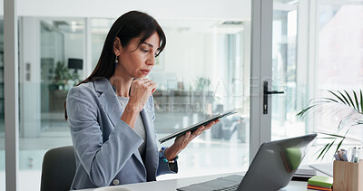 Buy stock photo Woman, reading and tablet in office with laptop, public relations thought and press release insight. Mature person, reflection and computer in workplace with tech, PR statement and campaign planning.