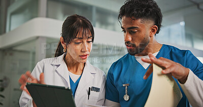 Buy stock photo Tablet, report and nurse with doctor in hospital lobby for advice with surgery, medicine or treatment plan. Teamwork, woman and man with information, document and support for healthcare professional