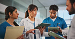 Tablet, paperwork and doctors with nurses in hospital for medical report, research or feedback. Digital technology, folders and team of healthcare employees in discussion for advice in clinic.