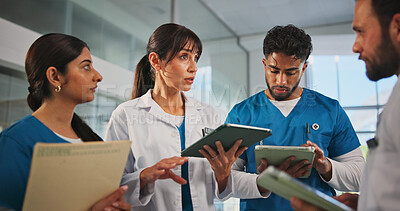 Buy stock photo Tablet, paperwork and doctors with nurses in hospital for medical report, research or feedback. Digital technology, folders and team of healthcare employees in discussion for advice in clinic.