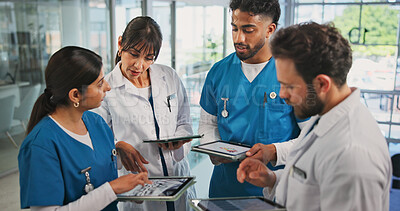 Buy stock photo Tablet, report and nurses with doctor in hospital lobby for advice with surgery, medicine or treatment plan. Teamwork, people and group with info, document and support for healthcare professional