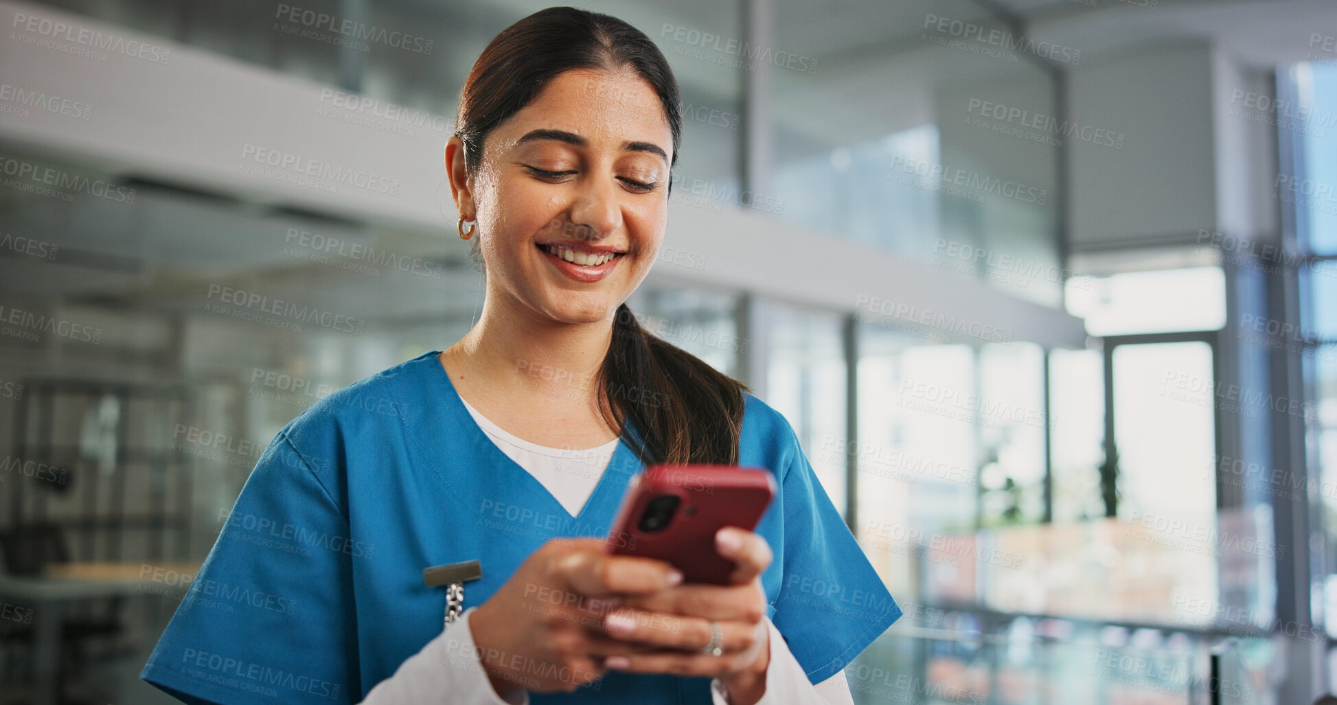 Buy stock photo Phone, woman and nurse in hospital with typing for texting, communication or email for telehealth. Happy, technology and healthcare worker with cellphone for contact, networking or medical support.