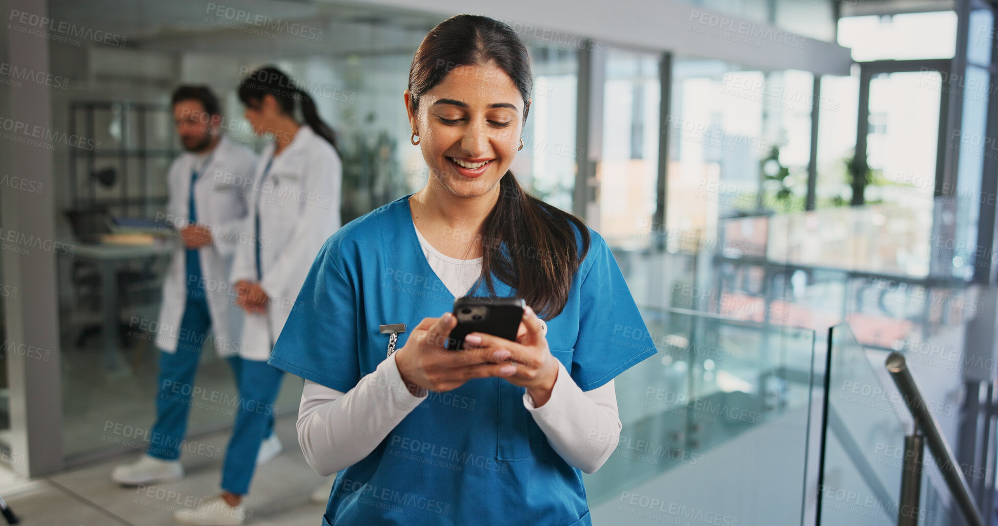 Buy stock photo Cellphone, woman and nurse in hospital with typing for texting, communication or email for telehealth. Happy, technology and healthcare worker with phone for contact, networking or medical support.