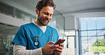 Phone, man and nurse in hospital with typing for texting, communication or email for telehealth. Happy, technology and male healthcare worker with cellphone for contact, networking or medical support