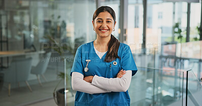 Buy stock photo Woman, nurse and smile at clinic with arms crossed, confidence and pride in corridor for healthcare. Person, medical professional and happy for service, portrait and wellness at hospital in Colombia