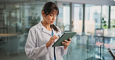 Buy stock photo Medical, scroll or woman in hospital with tablet, research or patient diagnosis in online consulting. Healthcare, mature or doctor in clinic with tech, telehealth or record review for treatment plan