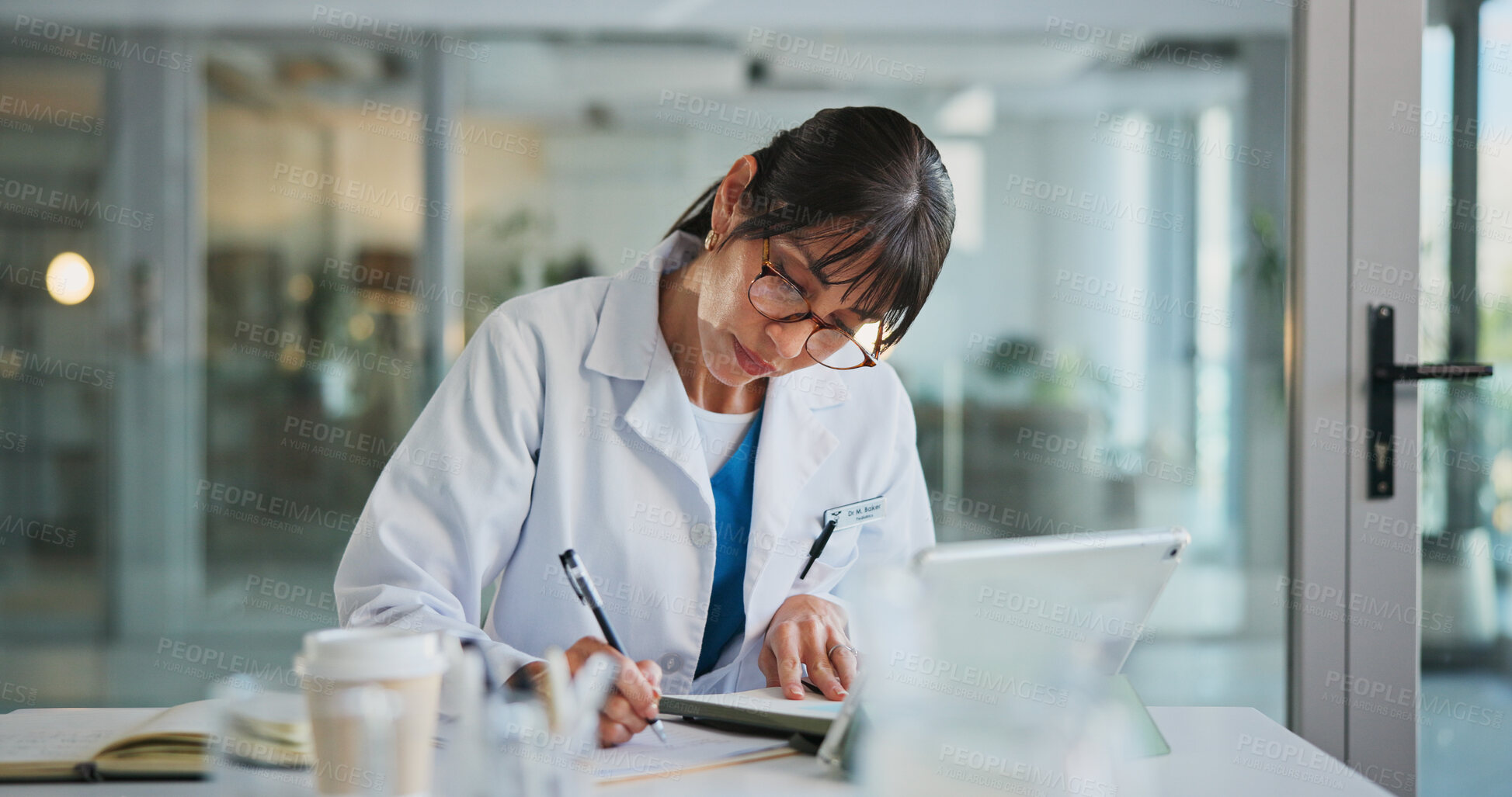 Buy stock photo Woman, doctor and writing in office for healthcare, prescription or notes. Patient report, administration and tech with mature medical professional and tablet for documents, schedule or planning
